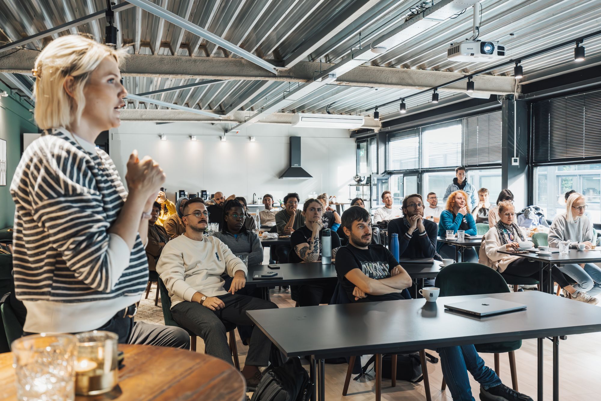 Speaker engaging an attentive workshop audience
